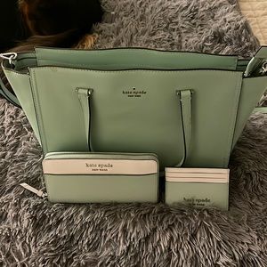 Kate Spade matching  set. Comes with purse, wallet, and a card holder.